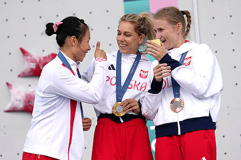 Women's speed final: Gold medallist Aleksandra Miroslaw of Poland, center, silver medallist Deng Lijuan of China, left, and bronze medallist Aleksandra Kalucka of Poland